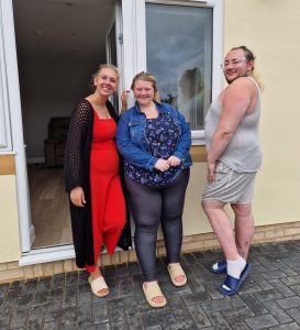 Chloe, Ryan and a representative from Homes and Horizons