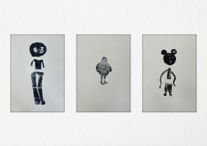 Three characters printed using black in.